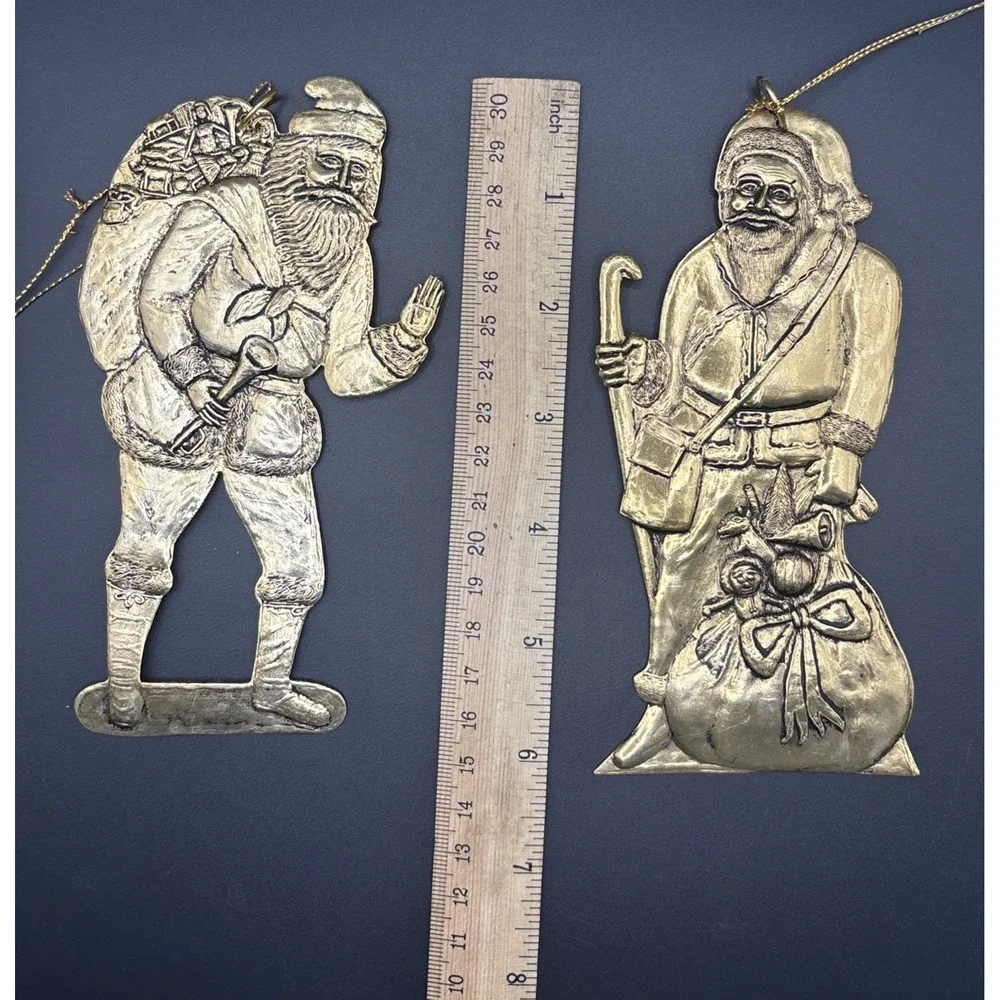 4 Vintage pressed‎ metal Santa with Gift Bag Christmas Tree ornaments aprox 6in.